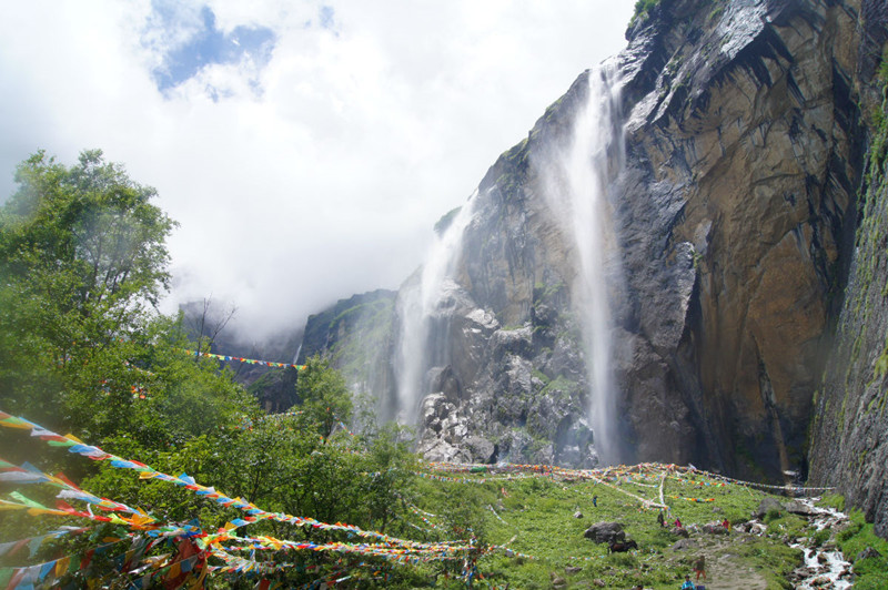 The Sacred Waterfall of Yubeng Village in Deqin County, Diqing