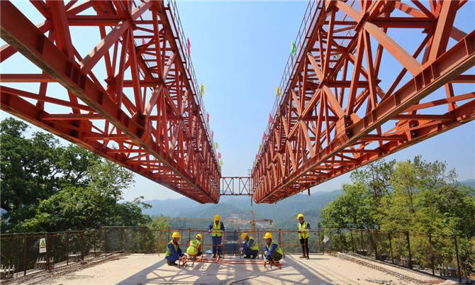 Employees work on the China-Laos railway project in Kunming, Yunnan province