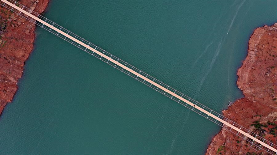 Aerial photo taken on Dec. 11, 2019 shows a bridge spanning the Niulan River in southwest China